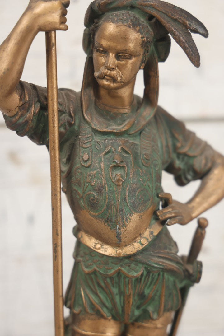 Lot 012 - Antique Cast Metal Statue Of A Soldier In Armor Holding A Spear, Note Green Man On Chest, Patinated, Gilded Finish, 16-1/8" Overall Height