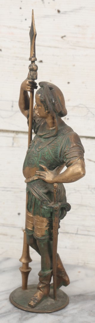 Lot 012 - Antique Cast Metal Statue Of A Soldier In Armor Holding A Spear, Note Green Man On Chest, Patinated, Gilded Finish, 16-1/8" Overall Height