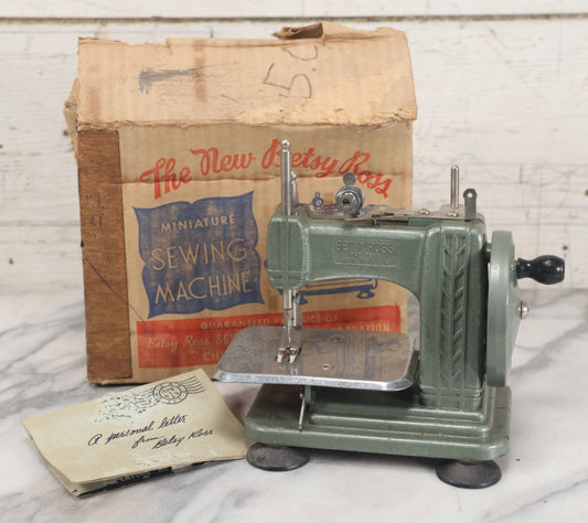 Lot 030 - Vintage The New Betsy Ross Miniature Sewing Machine In Original Box With Documentation, By Betsy Ross Sewing Machine Corporation, Chicago, Illinois, As Found, Untested