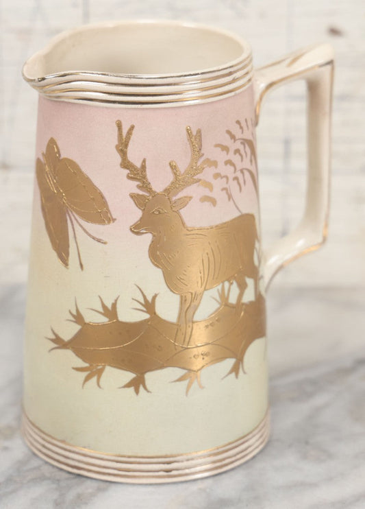 Lot 032 - Antique Ceramic Pitcher With Butterfly, Elk Motif, Pink And Gold Coloring, Minor Chipping
