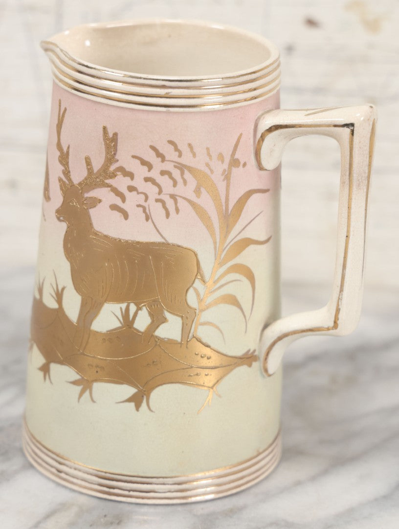 Lot 032 - Antique Ceramic Pitcher With Butterfly, Elk Motif, Pink And Gold Coloring, Minor Chipping