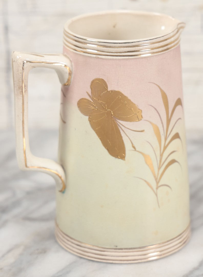 Lot 032 - Antique Ceramic Pitcher With Butterfly, Elk Motif, Pink And Gold Coloring, Minor Chipping