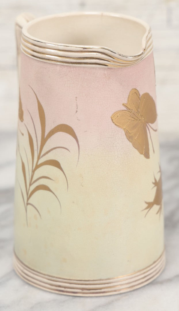 Lot 032 - Antique Ceramic Pitcher With Butterfly, Elk Motif, Pink And Gold Coloring, Minor Chipping