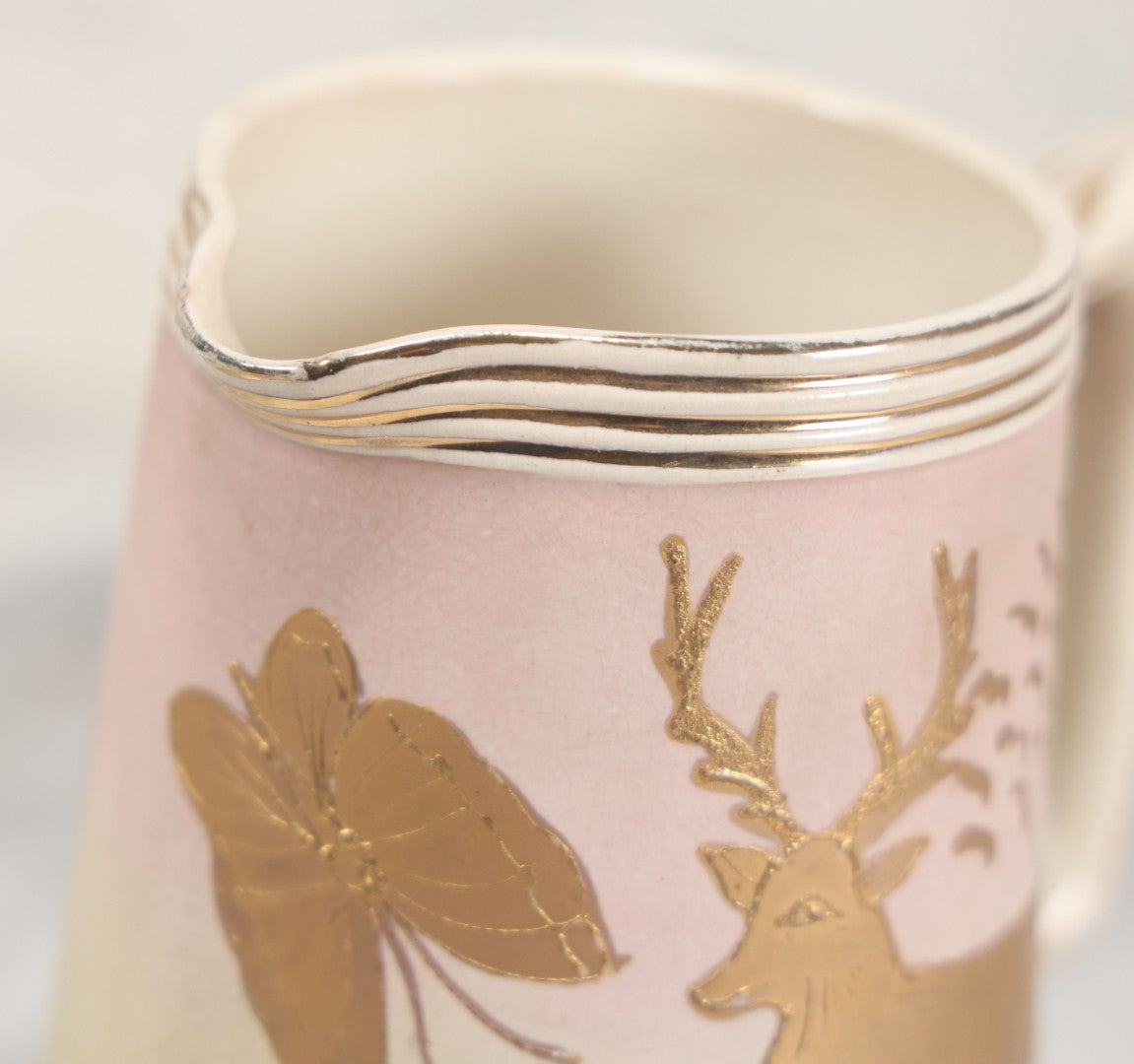 Lot 032 - Antique Ceramic Pitcher With Butterfly, Elk Motif, Pink And Gold Coloring, Minor Chipping
