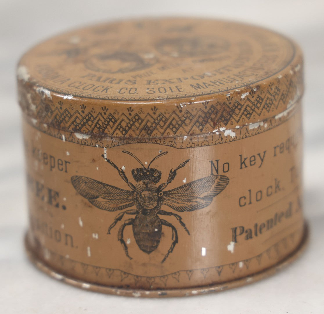 Lot 033 - Antique Advertising Tin For The One Day Bee Clock By Ansonia Clock Company, With Bee Graphics, Brooklyn, New York, Note Various Losses