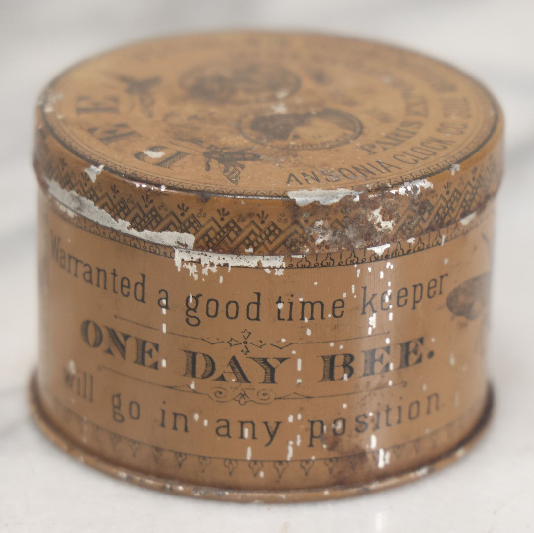 Lot 033 - Antique Advertising Tin For The One Day Bee Clock By Ansonia Clock Company, With Bee Graphics, Brooklyn, New York, Note Various Losses
