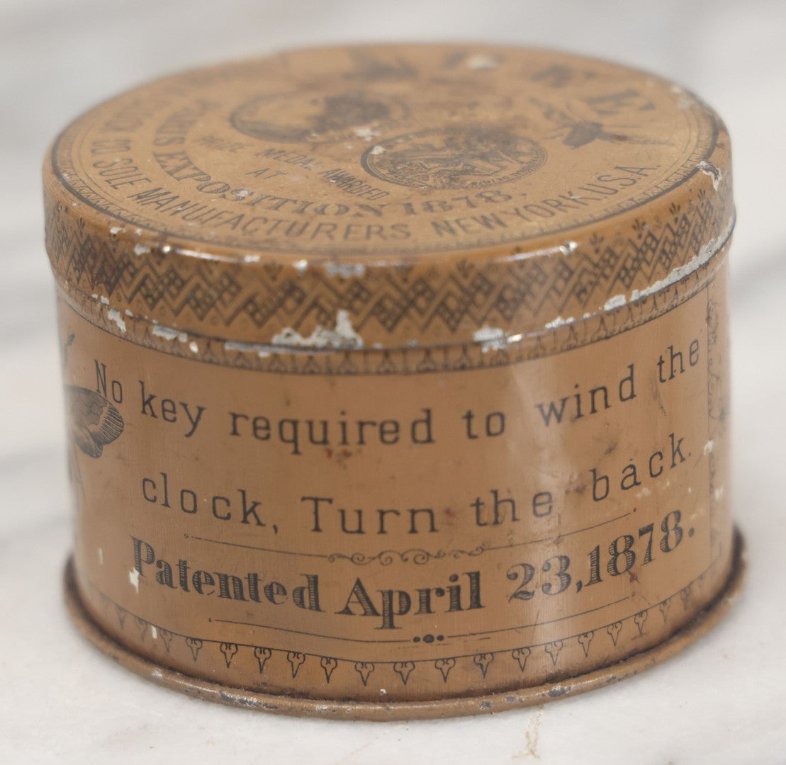 Lot 033 - Antique Advertising Tin For The One Day Bee Clock By Ansonia Clock Company, With Bee Graphics, Brooklyn, New York, Note Various Losses