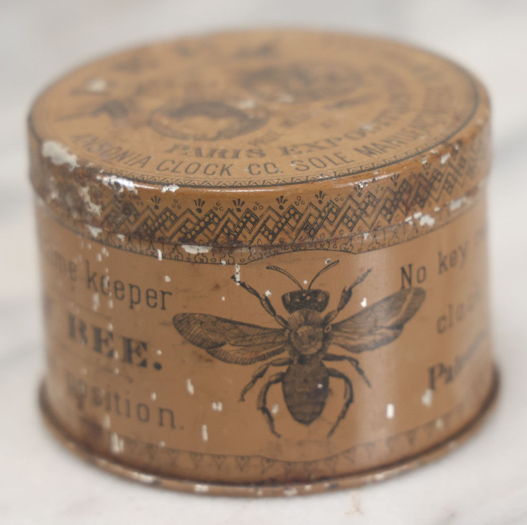 Lot 033 - Antique Advertising Tin For The One Day Bee Clock By Ansonia Clock Company, With Bee Graphics, Brooklyn, New York, Note Various Losses