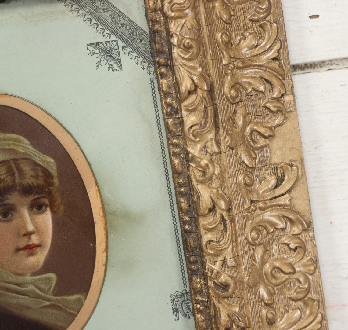 Lot 038 - Antique Chromolithograph Portrait Print Of A Victorian Woman In Headscarf, In Ornate Wooden Gilded Wooden Frame With Decorative Nature Motif Mat, 13-1/4" x 15-1/4"