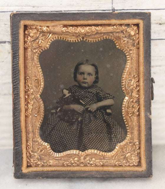 Lot 102 - Antique 1/6th Plate Cased Tintype Photograph Of A Little Girl Holding Her Doll, Half Leatherette Case