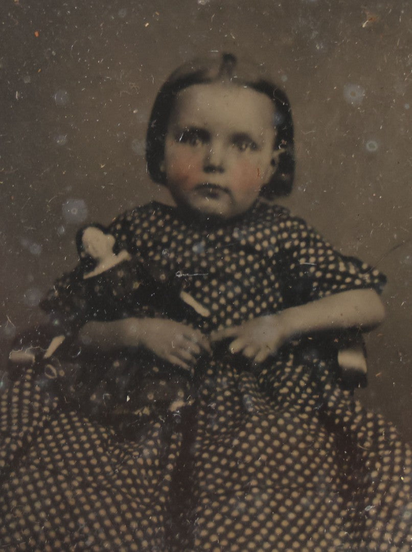 Lot 102 - Antique 1/6th Plate Cased Tintype Photograph Of A Little Girl Holding Her Doll, Half Leatherette Case