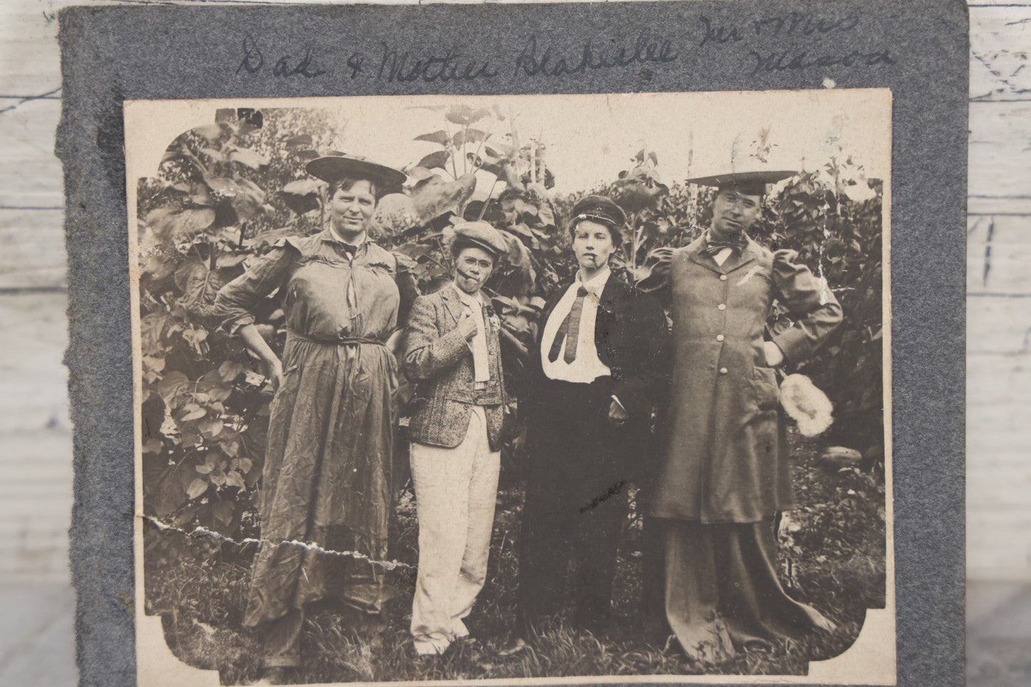 Lot 104 - Antique Snapshot Photo On Album Paper Of Two Couples Cross Dressing, Men In Dresses, Women Smoking Cigars, Identified
