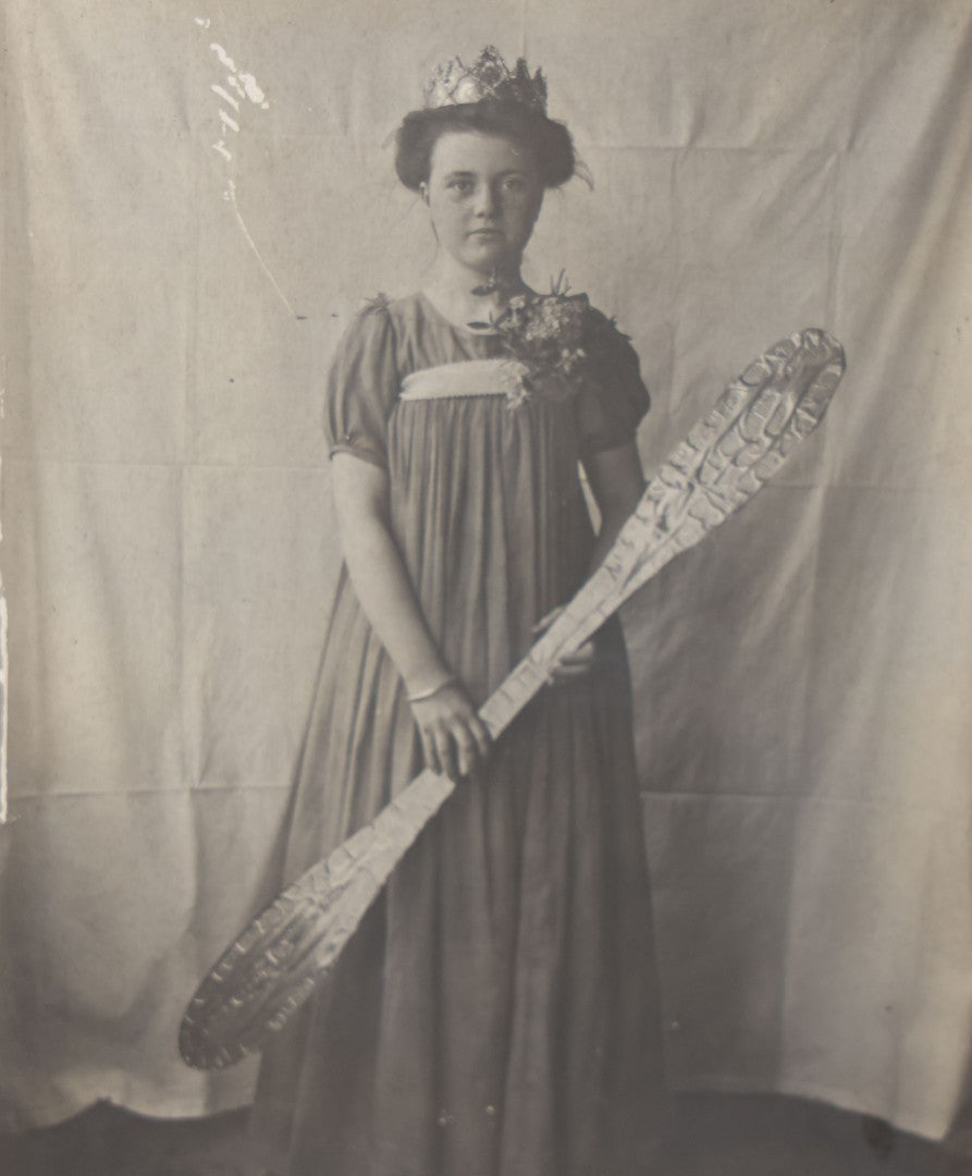 Lot 108 - Antique Boarded Photo Of A Young Woman In A Crown Holding A Silvery Foil Covered Paddle, Unknown Occasion