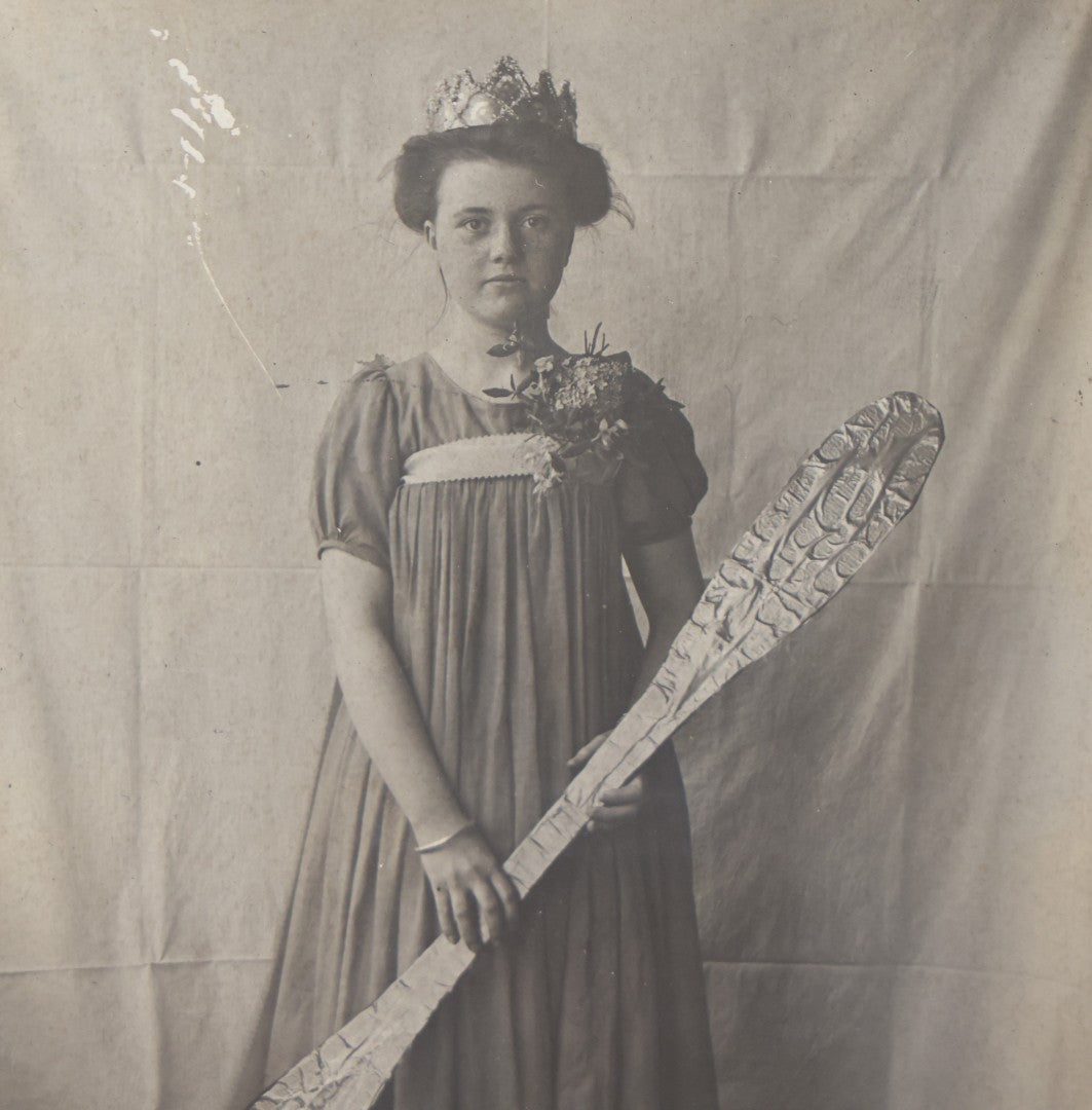 Lot 108 - Antique Boarded Photo Of A Young Woman In A Crown Holding A Silvery Foil Covered Paddle, Unknown Occasion