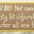Lot 031 - Vintage Hand Painted Pool Hall Sign On Press Board, "House Rule: Not More Than 20 Lit Cigarettes," Note Corner Losses, Wear, Wrapped With Backing Board, 24-1/4" x 11-1/4"