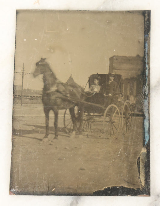 Lot 060 - Single Antique Tintype Photograph, Man And Woman Riding In Horse Drawn Carriage, With Blurry Horse
