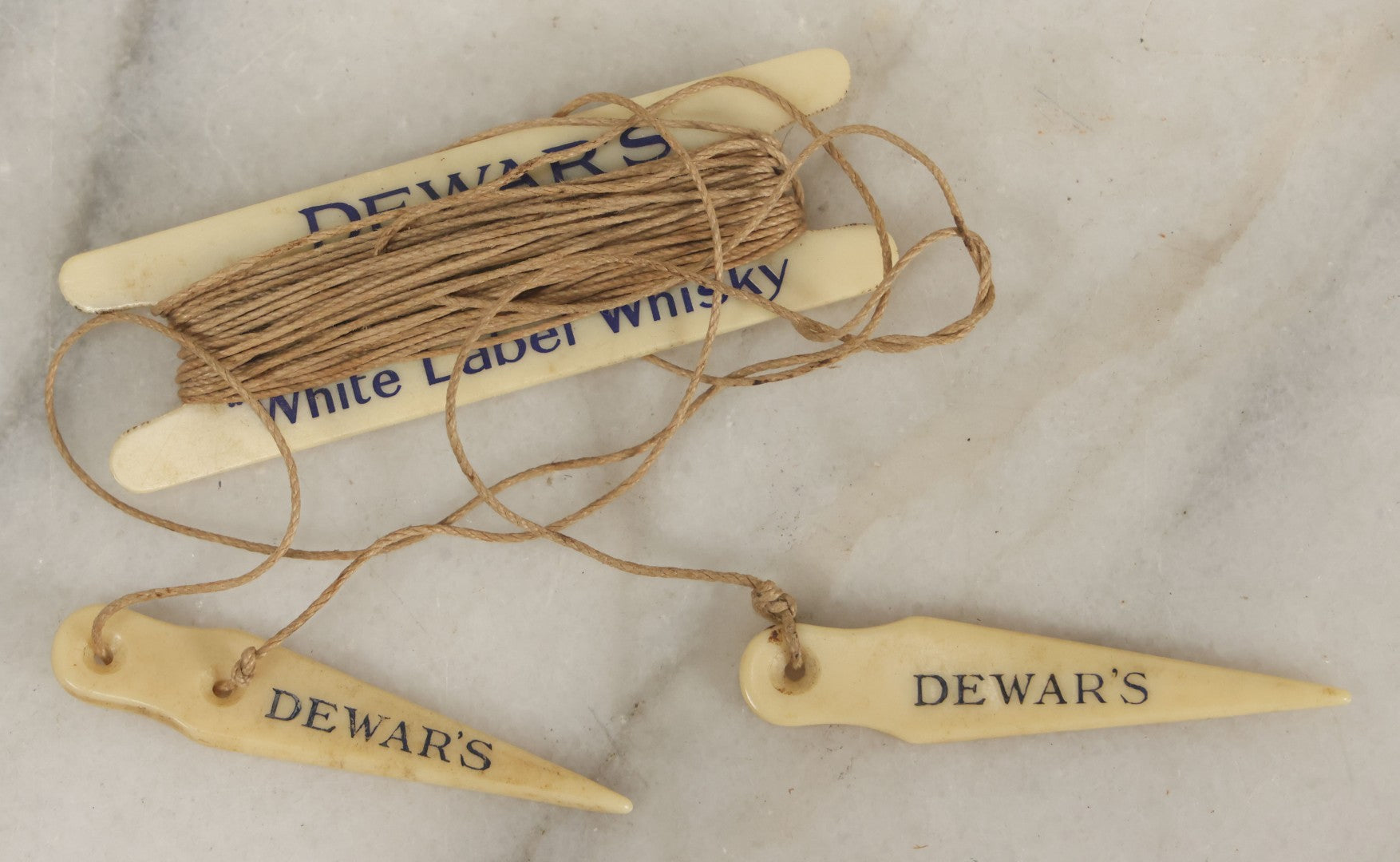 Lot 052 - Vintage Dewar’s White Label Whisky String Holder With Bone Tags, Advertising Collectible