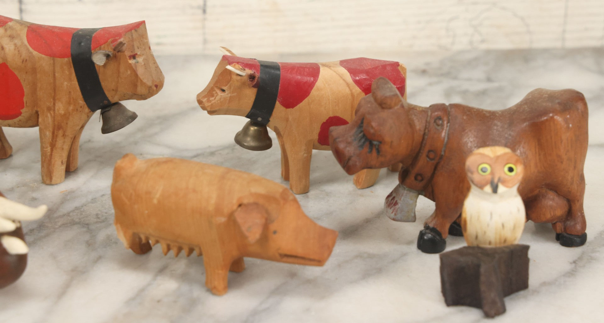 Lot 062 - Grouping Of Vintage Hand-Carved Wooden Animal Figures, Cows, Pig, Dinosaur, Owl, And Folk Art Pieces
