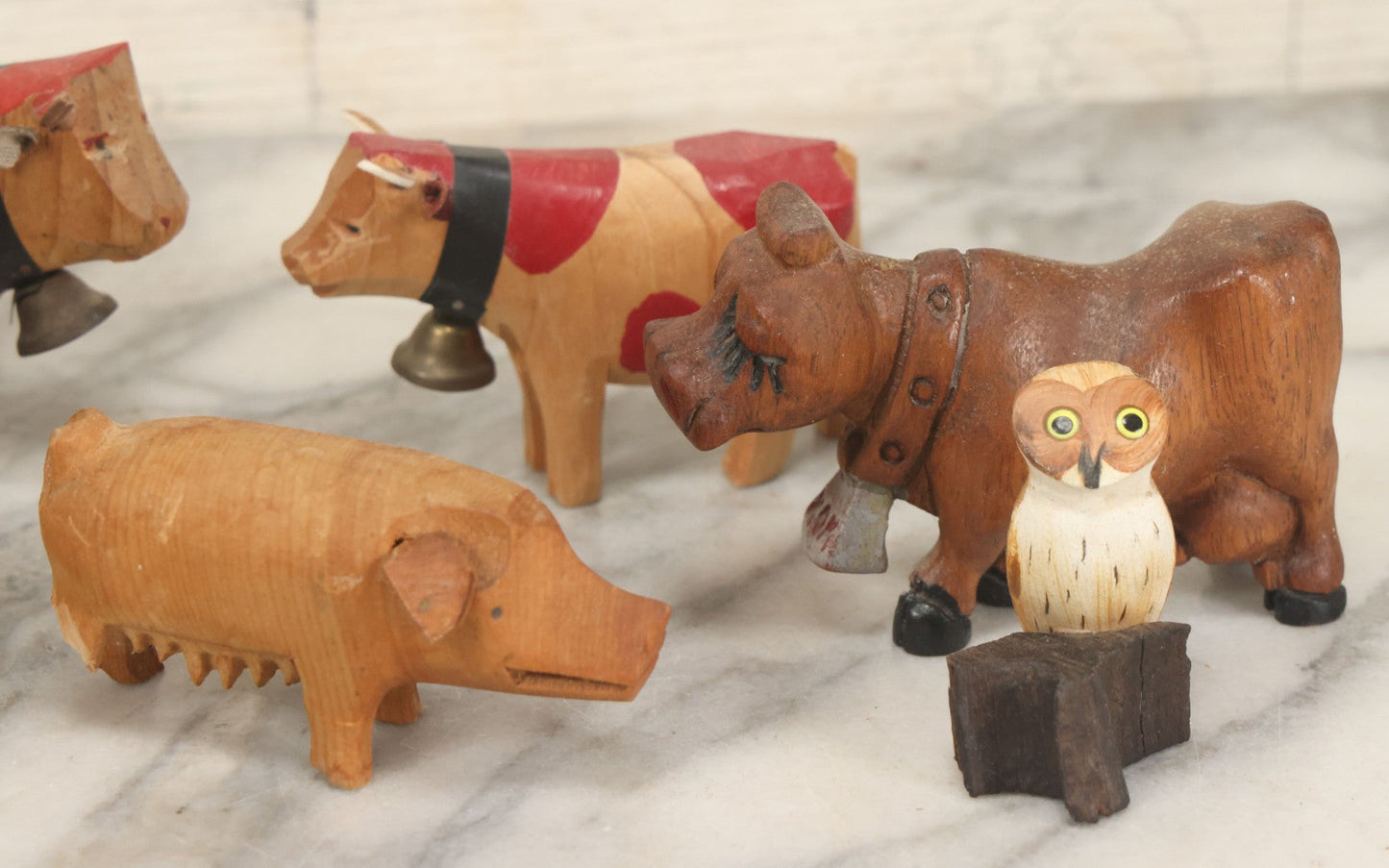 Lot 062 - Grouping Of Vintage Hand-Carved Wooden Animal Figures, Cows, Pig, Dinosaur, Owl, And Folk Art Pieces