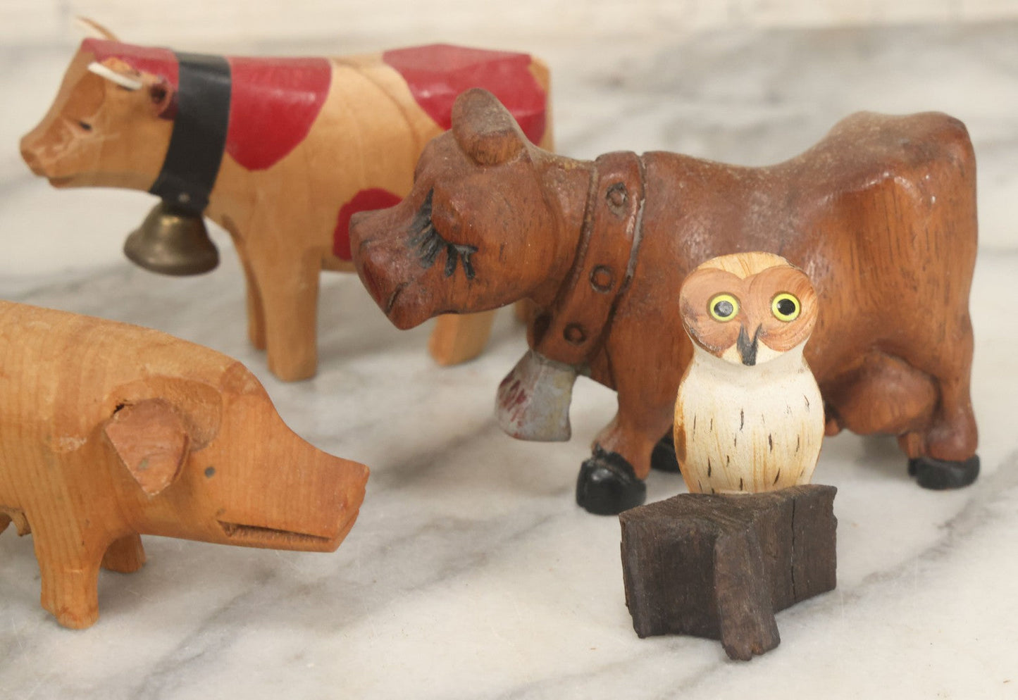 Lot 062 - Grouping Of Vintage Hand-Carved Wooden Animal Figures, Cows, Pig, Dinosaur, Owl, And Folk Art Pieces