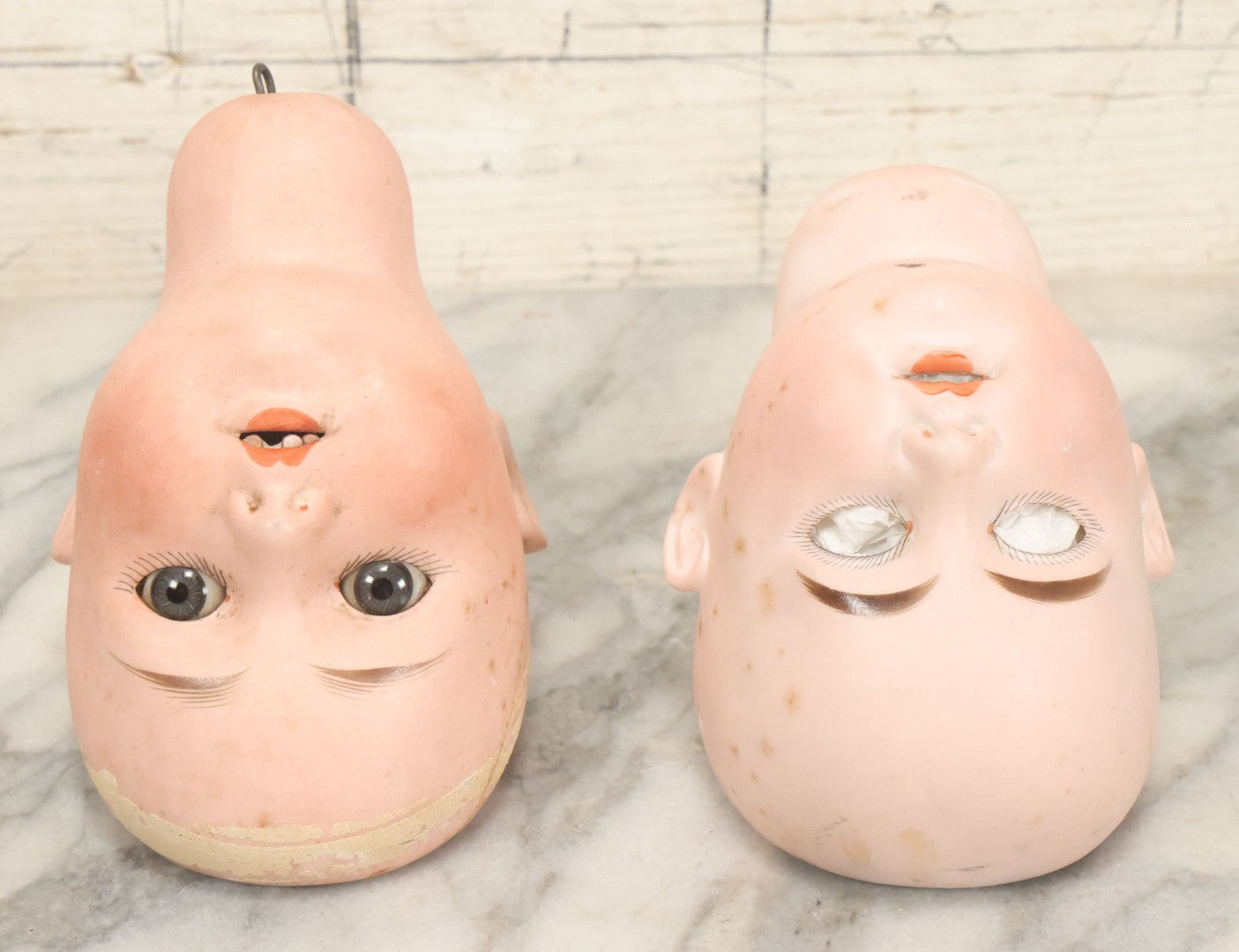 Lot 064 - Pair Of Antique Porcelain Doll Heads With Glass Eyes, Note Cracks, Missing Parts, And Age Wear, Armand Marseille 1894 & Limbach Wally