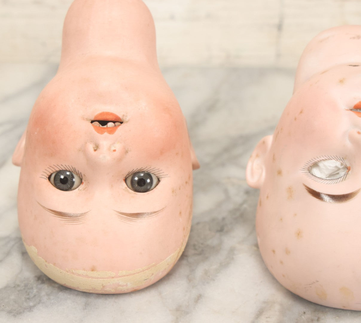 Lot 064 - Pair Of Antique Porcelain Doll Heads With Glass Eyes, Note Cracks, Missing Parts, And Age Wear, Armand Marseille 1894 & Limbach Wally