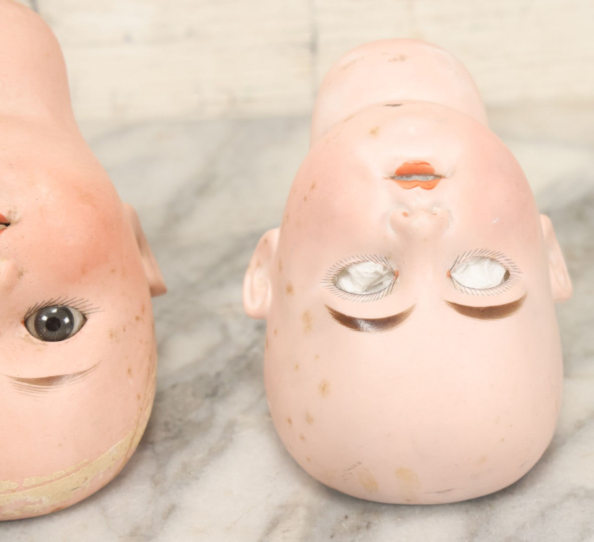 Lot 064 - Pair Of Antique Porcelain Doll Heads With Glass Eyes, Note Cracks, Missing Parts, And Age Wear, Armand Marseille 1894 & Limbach Wally