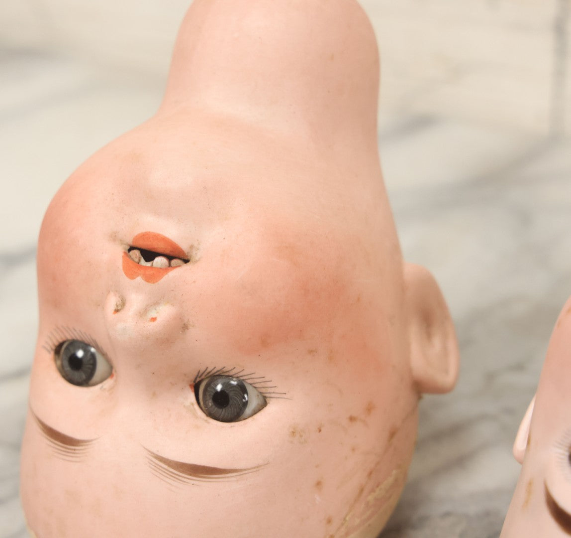 Lot 064 - Pair Of Antique Porcelain Doll Heads With Glass Eyes, Note Cracks, Missing Parts, And Age Wear, Armand Marseille 1894 & Limbach Wally