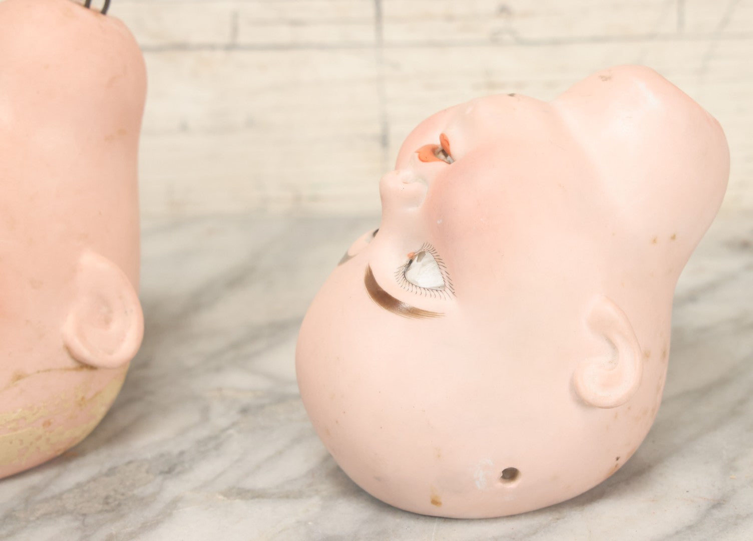 Lot 064 - Pair Of Antique Porcelain Doll Heads With Glass Eyes, Note Cracks, Missing Parts, And Age Wear, Armand Marseille 1894 & Limbach Wally