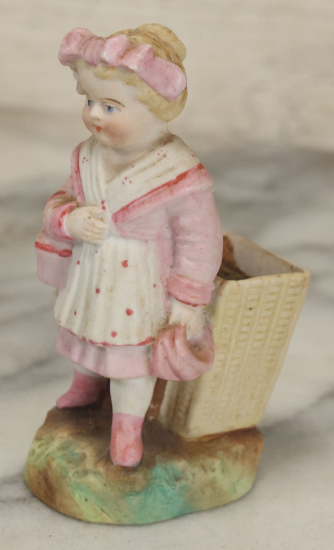 Lot 065 - Antique Hand-Painted Bisque Girl Figural Match Strike, Match Safe, Pink Dress And Bonnet, Likely German