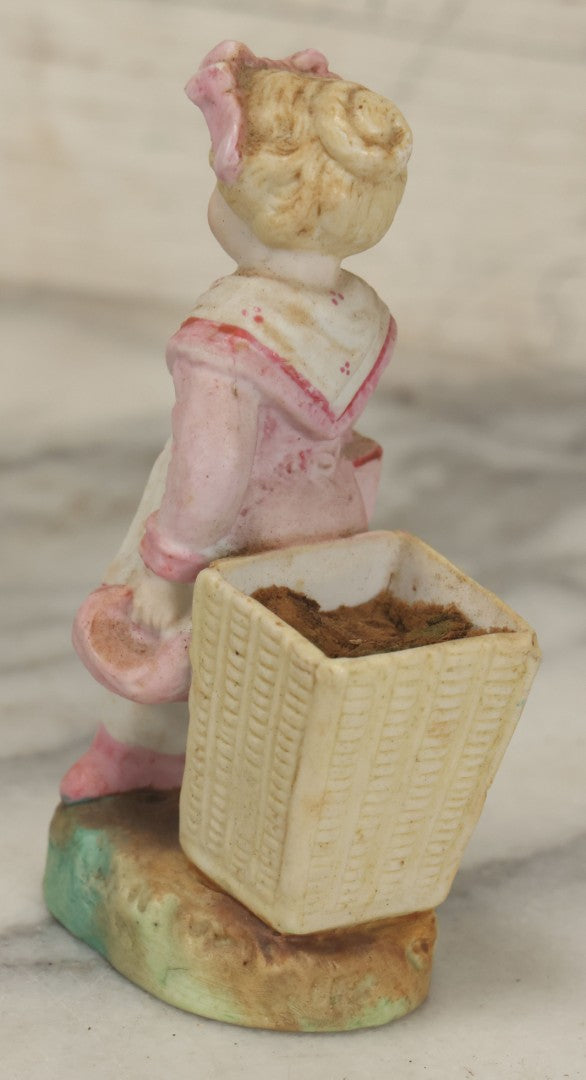 Lot 065 - Antique Hand-Painted Bisque Girl Figural Match Strike, Match Safe, Pink Dress And Bonnet, Likely German