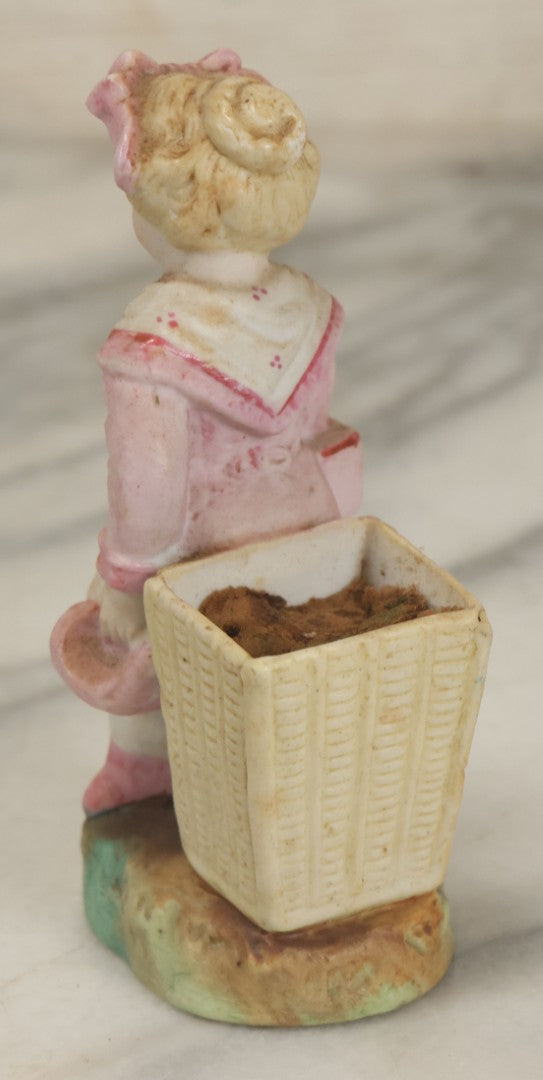 Lot 065 - Antique Hand-Painted Bisque Girl Figural Match Strike, Match Safe, Pink Dress And Bonnet, Likely German