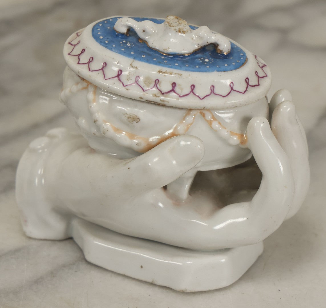 Lot 066 - Antique Porcelain Hand Holding Lidded Trinket Box, Ornate Decorative Design, Note Finial Broken Off, Included
