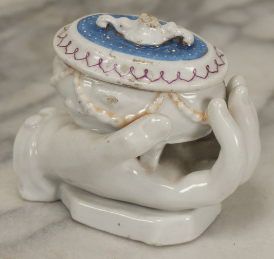 Lot 066 - Antique Porcelain Hand Holding Lidded Trinket Box, Ornate Decorative Design, Note Finial Broken Off, Included