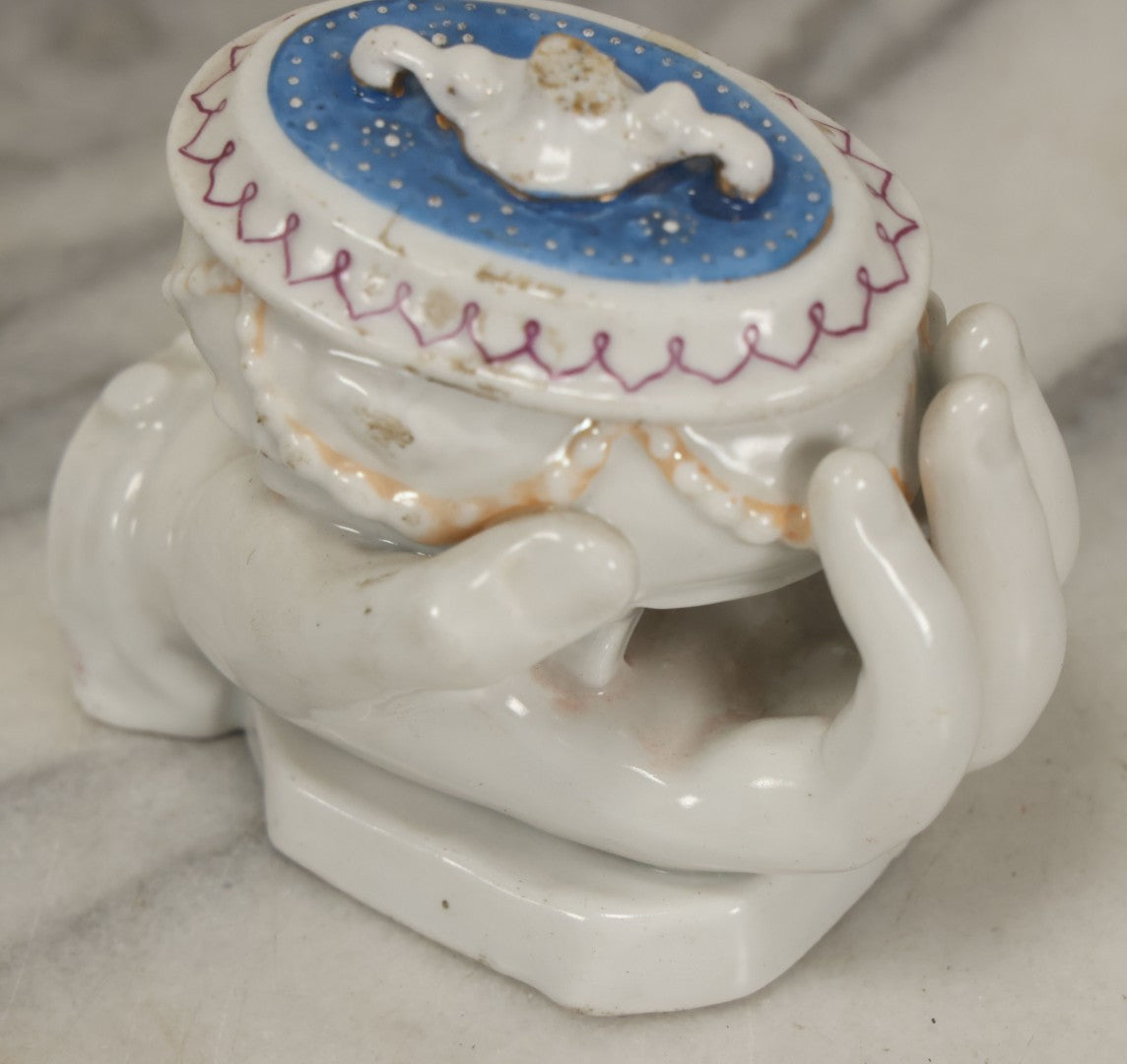 Lot 066 - Antique Porcelain Hand Holding Lidded Trinket Box, Ornate Decorative Design, Note Finial Broken Off, Included
