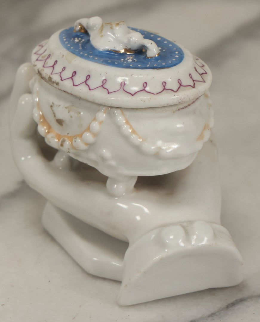 Lot 066 - Antique Porcelain Hand Holding Lidded Trinket Box, Ornate Decorative Design, Note Finial Broken Off, Included