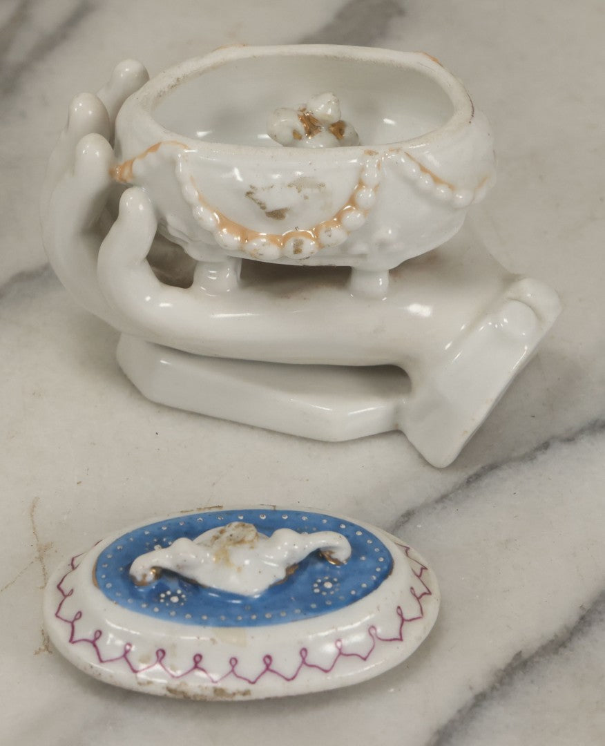 Lot 066 - Antique Porcelain Hand Holding Lidded Trinket Box, Ornate Decorative Design, Note Finial Broken Off, Included