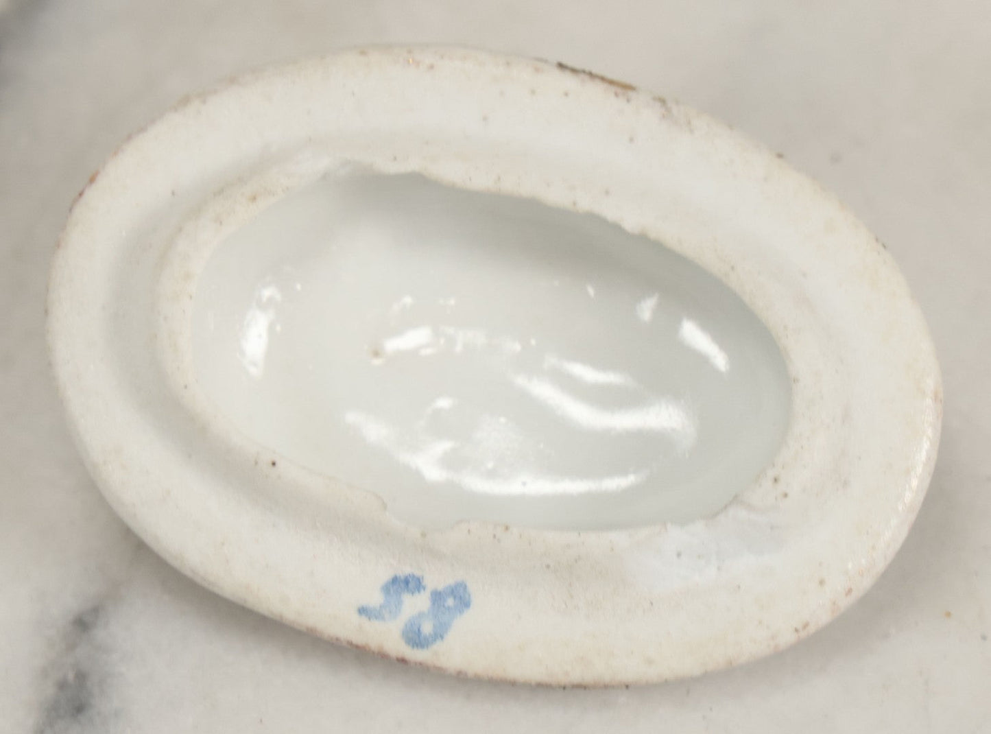Lot 066 - Antique Porcelain Hand Holding Lidded Trinket Box, Ornate Decorative Design, Note Finial Broken Off, Included