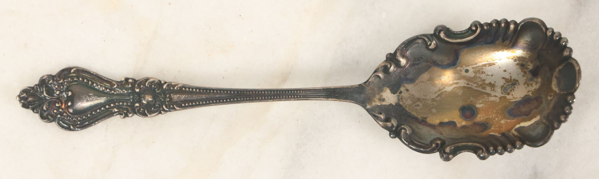 Lot 073 - Antique Rococo-Style Sterling Silver Serving Spoon, Ornate Floral And Scrollwork Handle