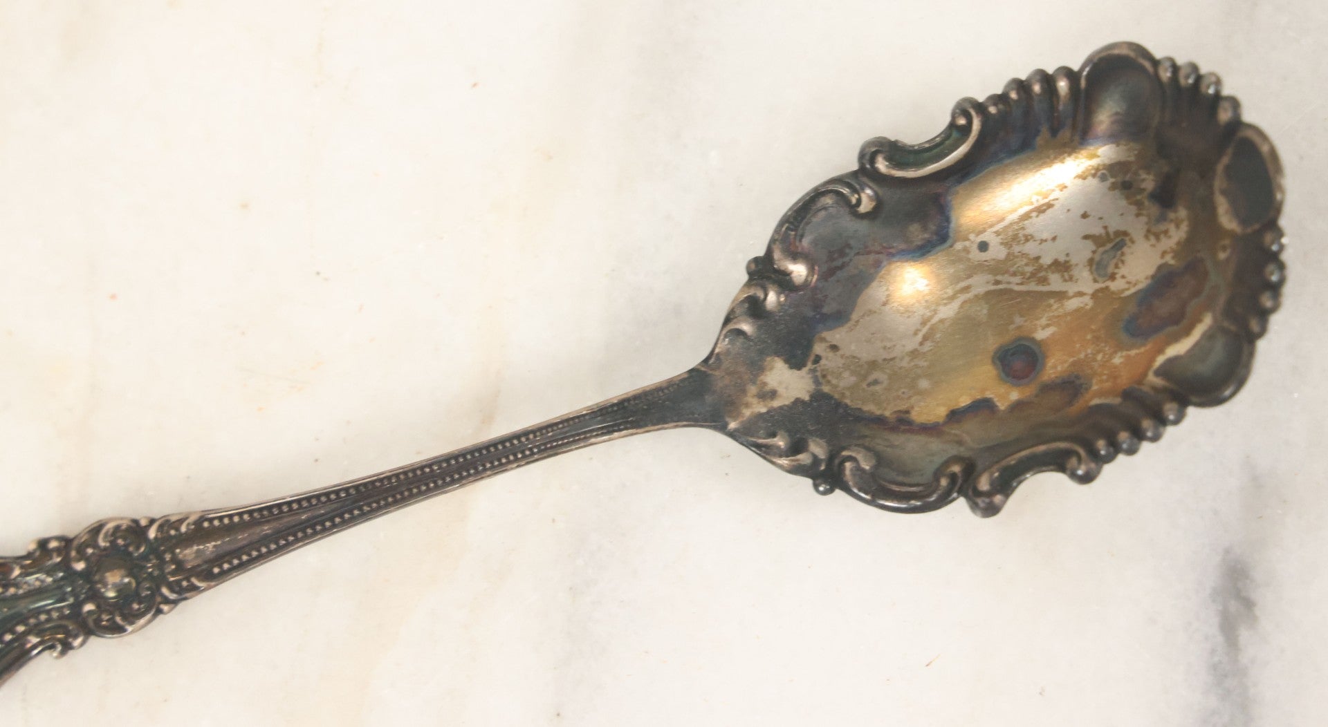 Lot 073 - Antique Rococo-Style Sterling Silver Serving Spoon, Ornate Floral And Scrollwork Handle