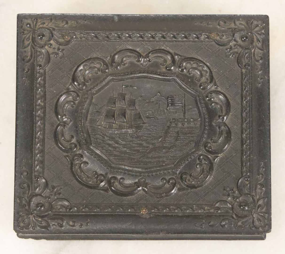 Lot 081 - Antique 1/6th Plate Tintype Photograph Of A Grandfather And Grand Daughter In Hand Tinted Green Dress, In Thermoplastic Union Case With Naval Ship Motif, Flag