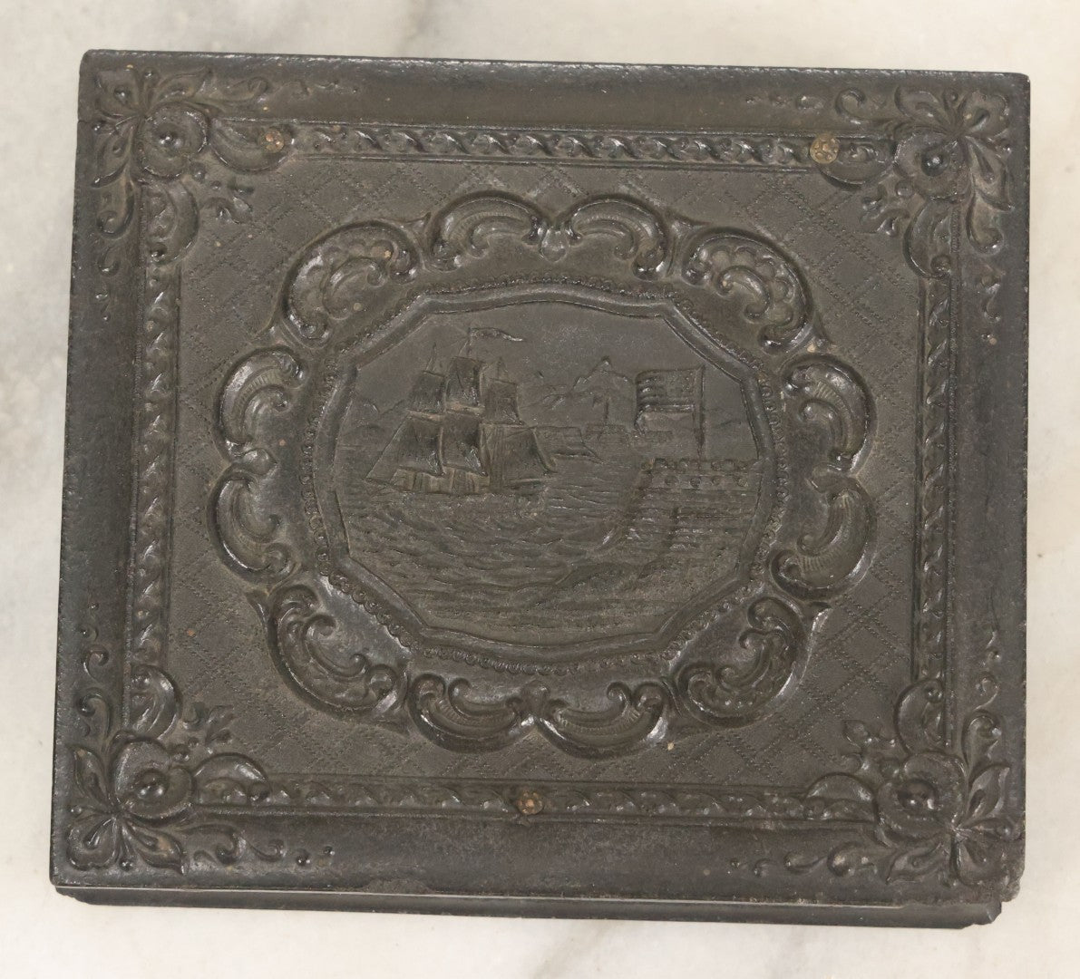 Lot 081 - Antique 1/6th Plate Tintype Photograph Of A Grandfather And Grand Daughter In Hand Tinted Green Dress, In Thermoplastic Union Case With Naval Ship Motif, Flag