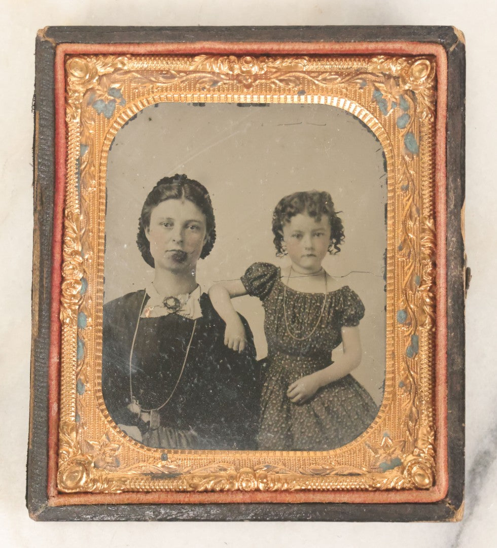 Lot 082 - Antique 1/6th Plate Tintype Photograph Of A Mother And Her Curly Haired Daughter, In Full Split Leatherette Union Case