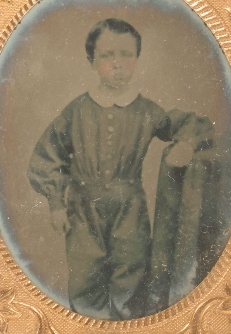 Lot 084 - Antique 1/9th Plate Ruby Ambrotype Photograph Of A Little Boy In A One Piece Suit, Leaning On Table