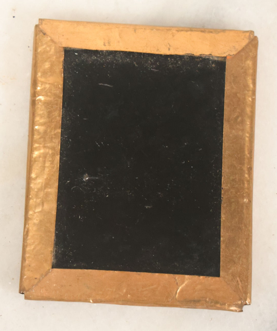 Lot 086 - Antique 1/9th Plate Ruby Ambrotype Photograph Of A Baby In A White Dress Seated In A Chair, Slack Jawed Expression, Note Scratches