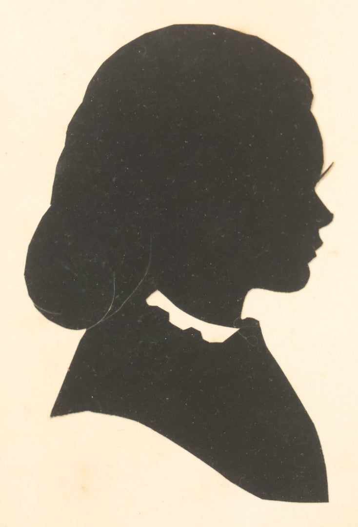 Lot 095 - Antique Hand Cut Paper Silhouette Of A Young Girl In A Deep Oval Frame, 11-3/8 x 13-3/8"