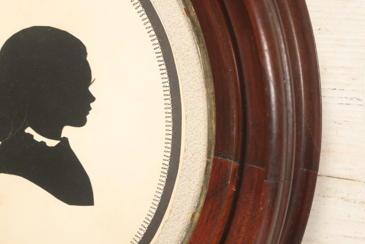 Lot 095 - Antique Hand Cut Paper Silhouette Of A Young Girl In A Deep Oval Frame, 11-3/8 x 13-3/8"