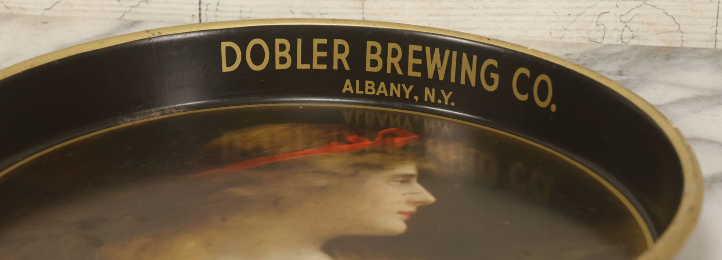 Lot 100 - Vintage Dobler Brewing Company Tin Lithograph Beer Tray With Beautiful Woman, Albany, New York, After A. Asti, 13-1/4" Diameter