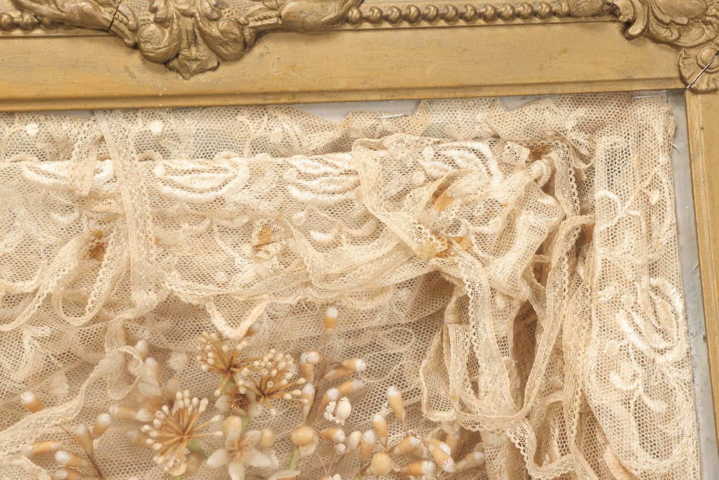 Lot 009 - Antique Victorian Wedding Commemoration Shadow Box With Lace Wedding Veil, Faux Floral Adornments, Cabinet Card Photograph Of Couple At Center, In Gesso Frame, 20-1/2" x 24-1/2" x 3-3/4"