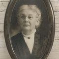Lot 074 - Antique Oval Shaped Sterling Silver Frame With A Photograph Of An Elderly Woman, Note Missing Kickstand On Back, Marked Sterling, 3" x 5-3/8"